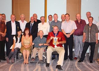 Members of the Rotary Club Taksin-Pattaya pose for one final group photo before merging with the Rotary Club of the Eastern Seaboard.